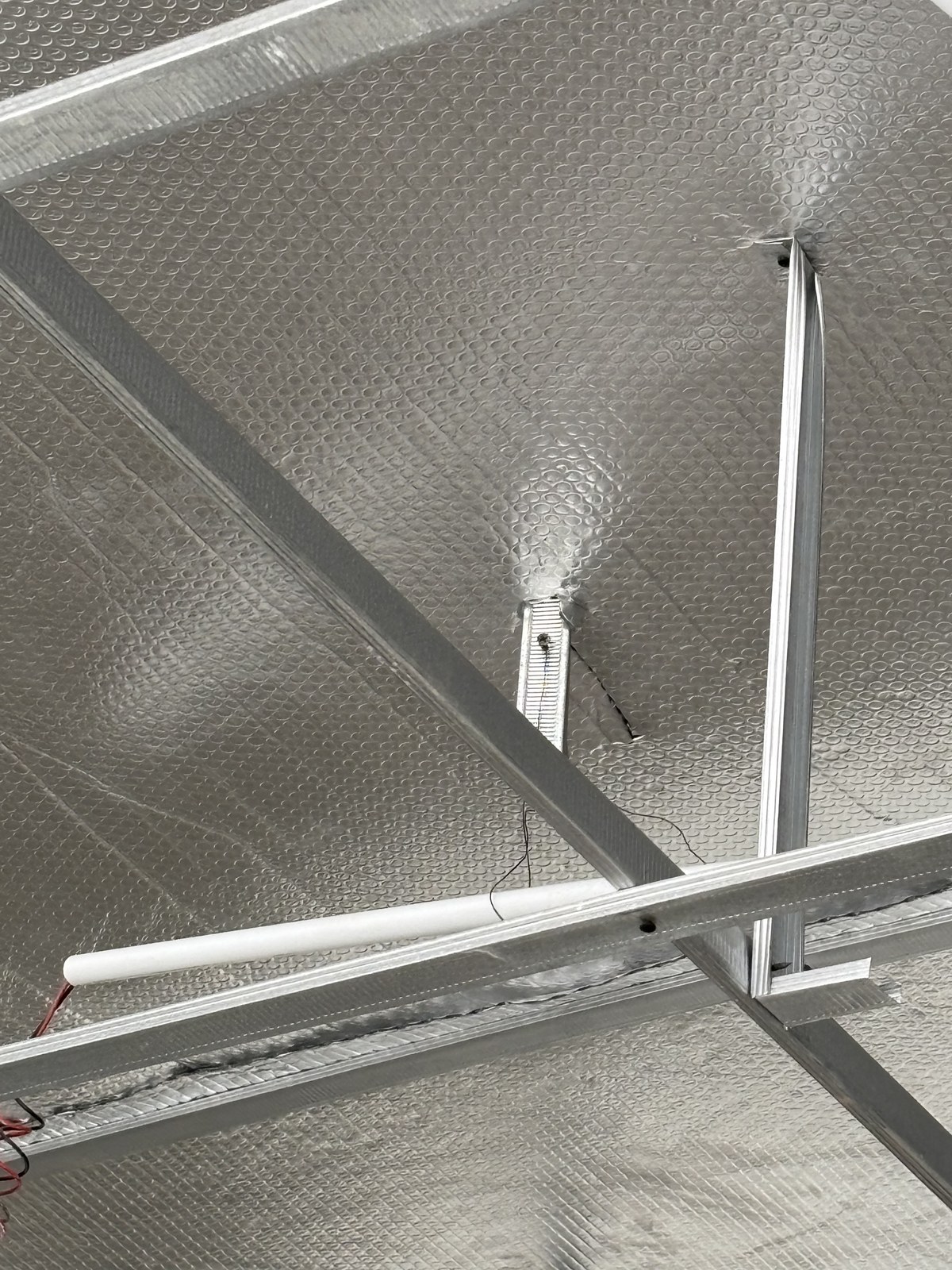 JA House — reflective insulation detail, thermal layer installation — WE Arsitek